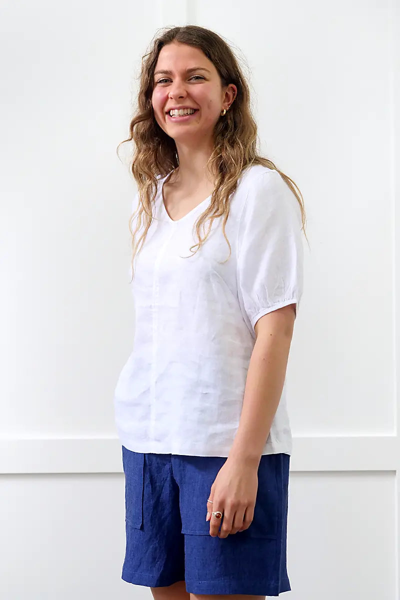 3/4 view of the See Saw Linen V-Neck Swing Top in White