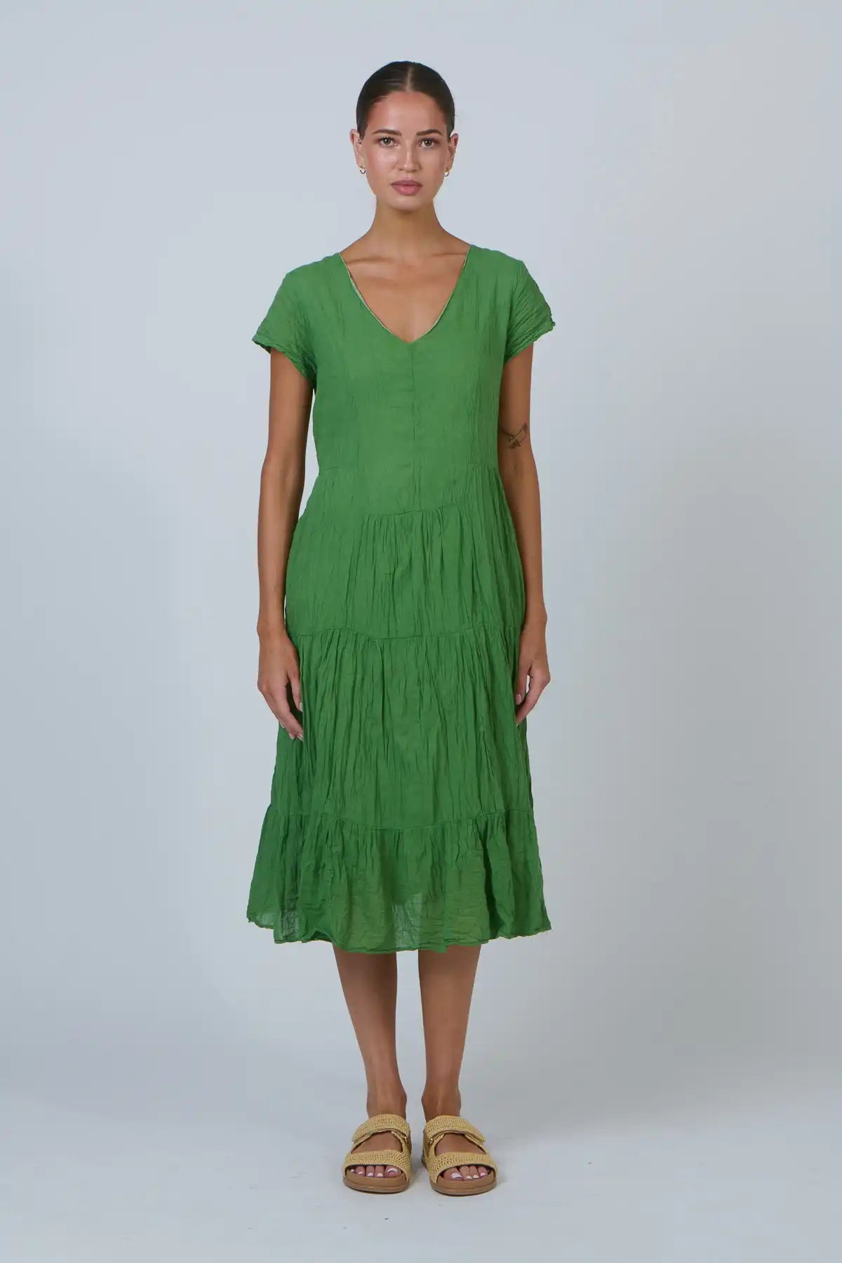 front on view of woman wearing Apple Meadow Tiered Cotton Midi Dress — Apple Green
