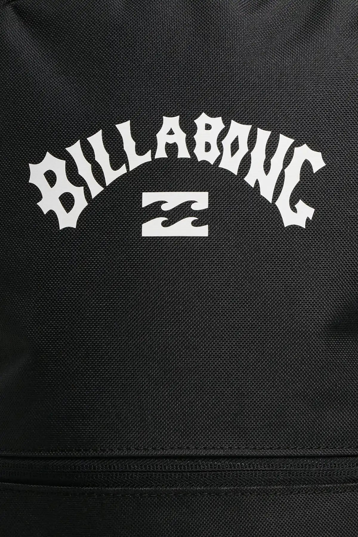 Close-up of a black bag with Billabong logo in white text.