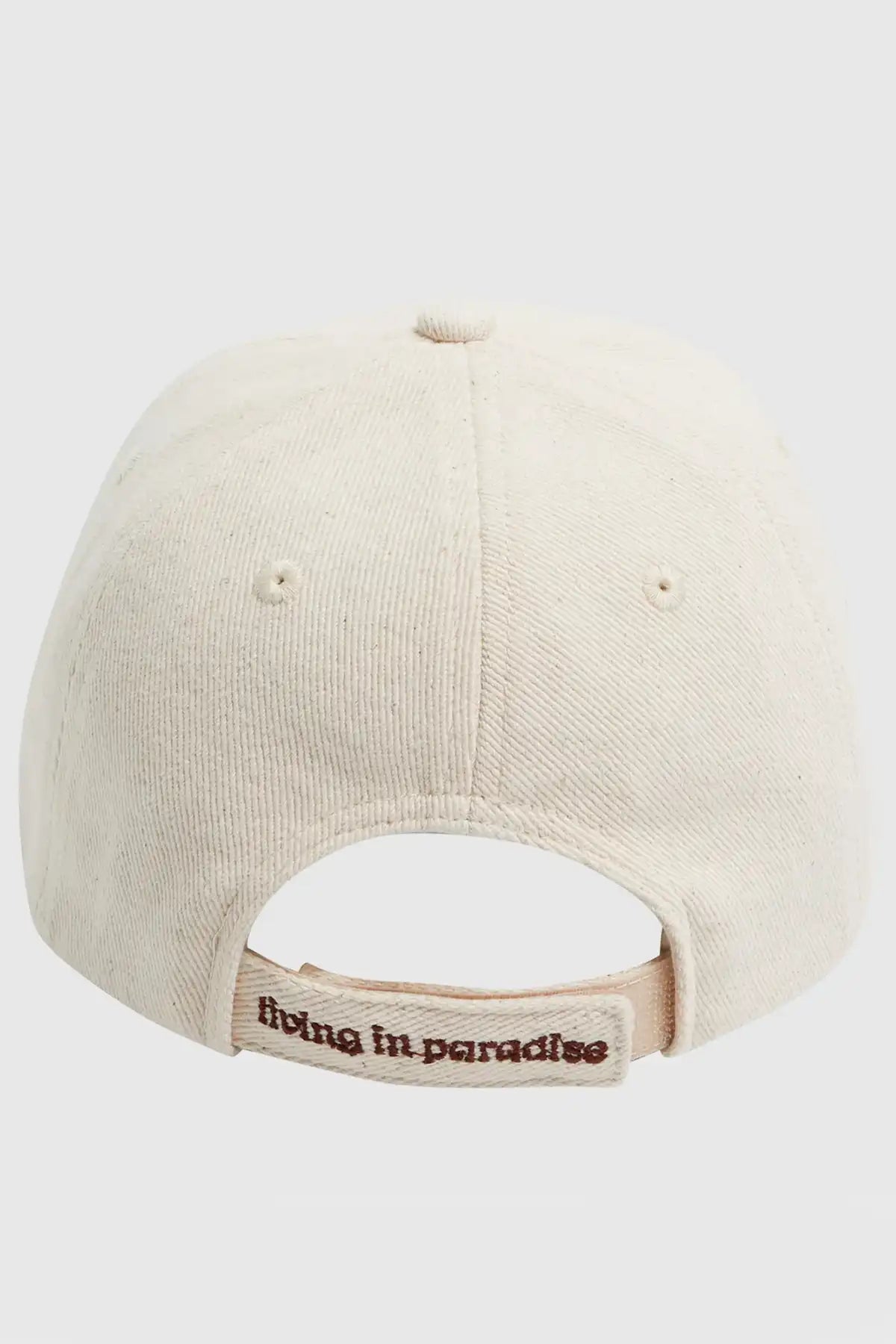 Billabong Womens Paradise Dad Cap in Antique White with 'living in paradise' text on closure strap against a white background