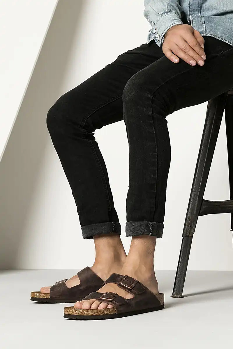 man wearing Birkenstock Arizona Habana Oiled Leather Sandals - Narrow Fit