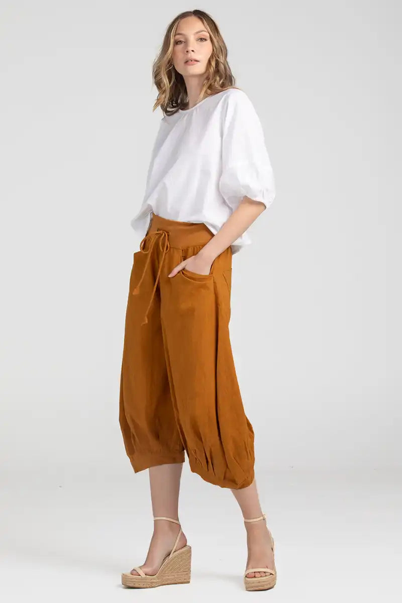 Boom Shankar Women's Guru Pant in Mustard side view with hands in pockets
