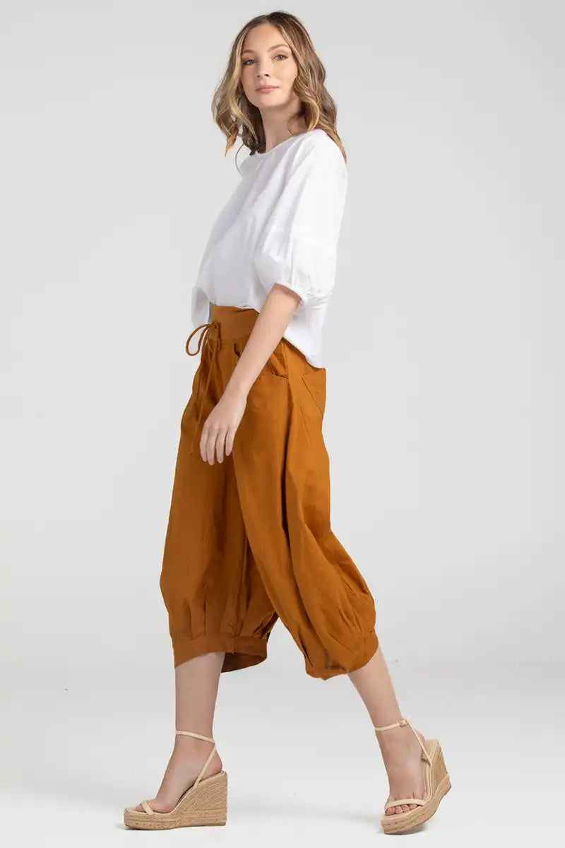 Boom Shankar Women's Guru Pant in Mustard side view with model walking