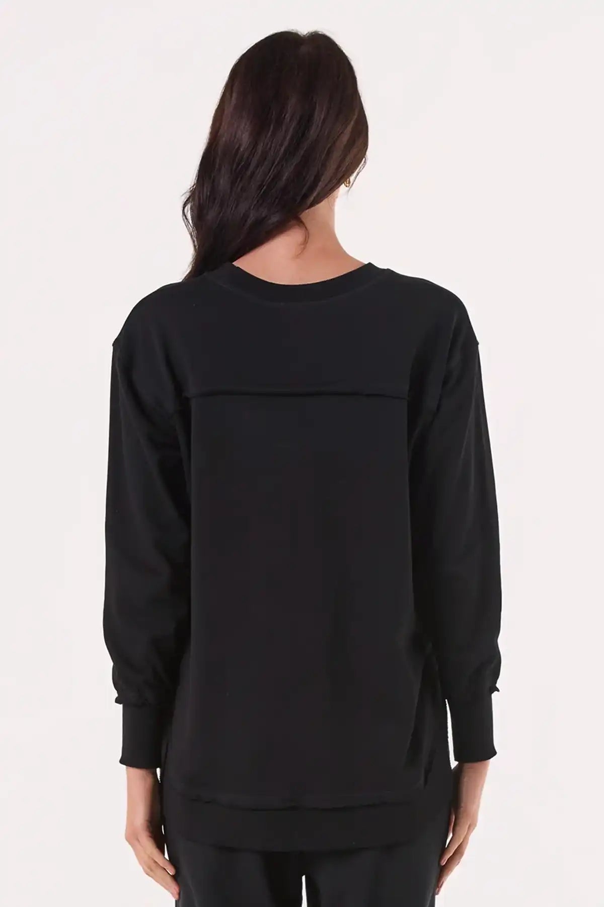 Person wearing a Chille Everyday Wander Pullover in Midnight Black long-sleeve top on a white background back view