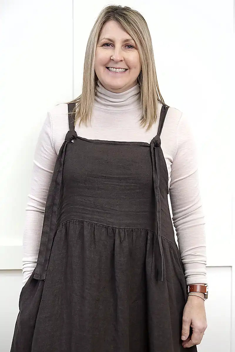 Chille Merino Whisper Top in natural under sofia chocolate pinafore dress front view