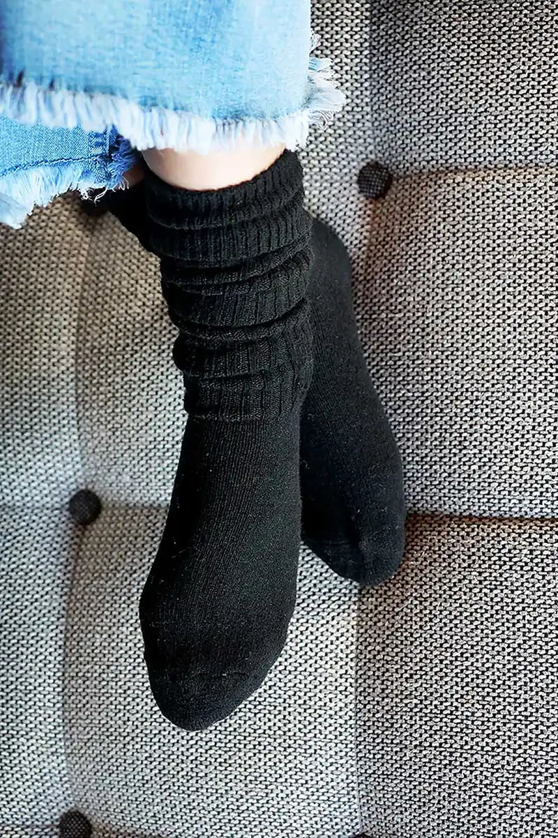 Chille Wool Blend Socks in Black close up view on the sofa