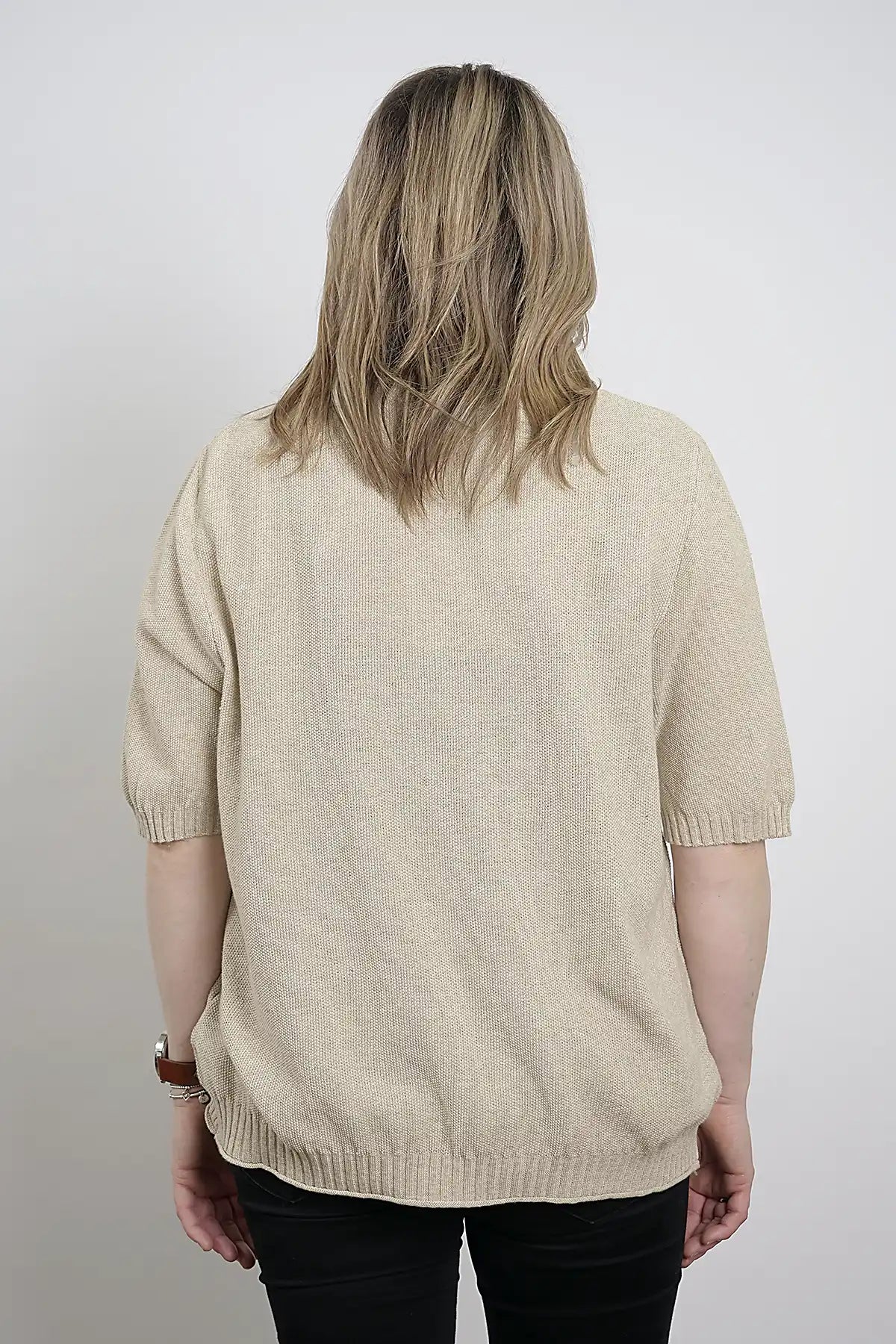 Person wearing a Coastal Ease Cotton Knit Tee in Sand from behind on a plain background
