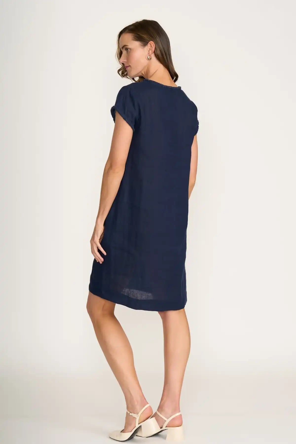 Woman wearing a Foil Linen Festival Dress in Eclipse on a white background back view