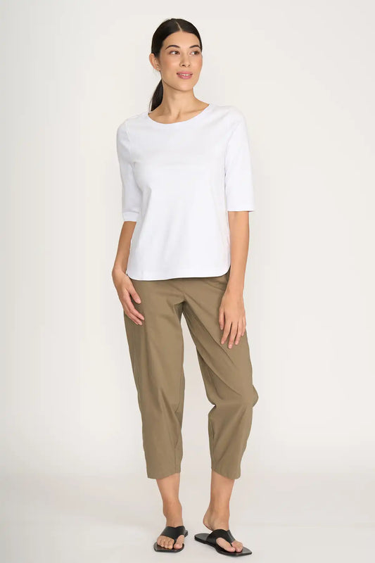 Woman wearing a white top and Foil Pump it Up Pant in Dune on a white background