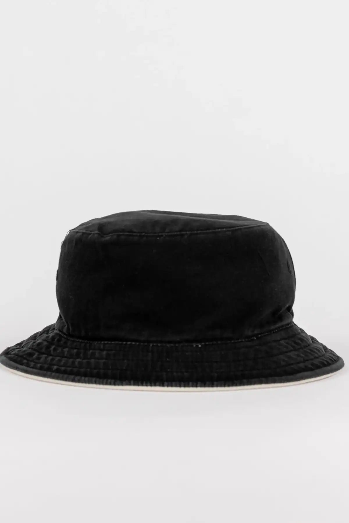 Rusty Kick Flip Reversible Bucket Hat showing washed black side back of hat on a white background