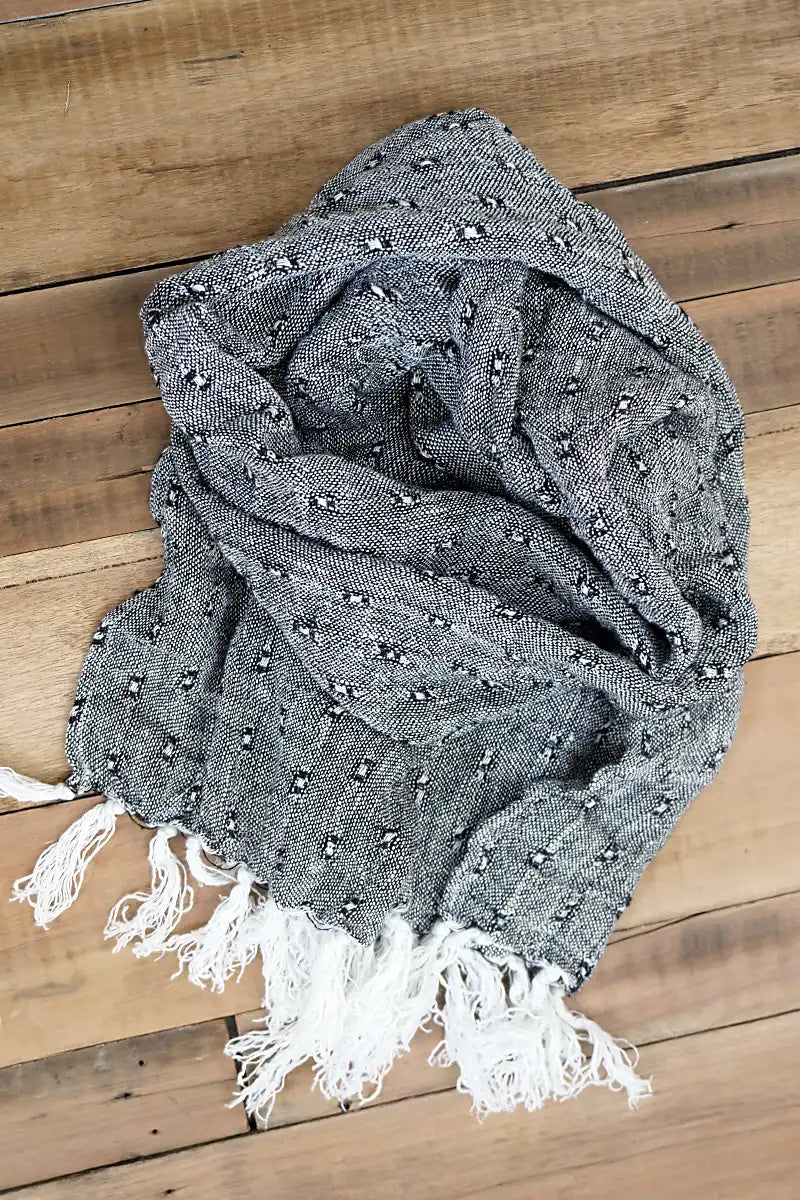 Le Quai Linen Scarf – Hand-Loomed in Monochrome flat lay on the floor