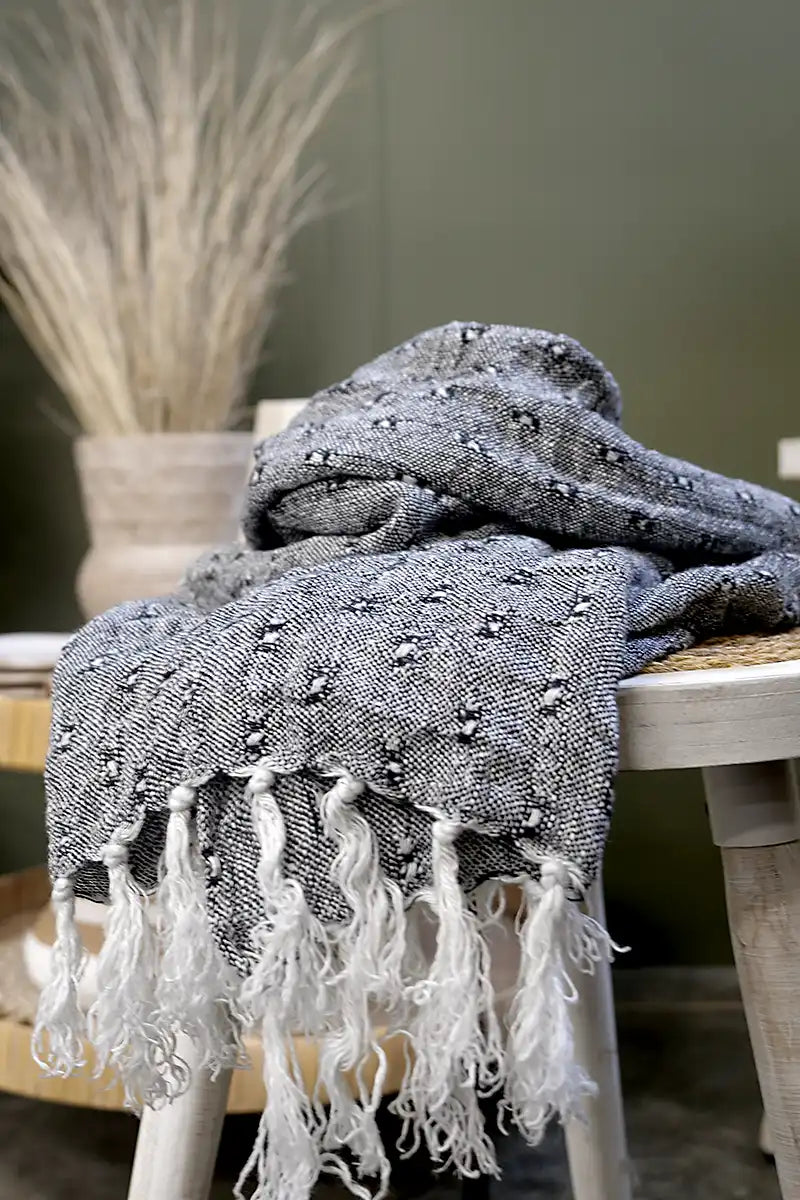 Le Quai Linen Scarf – Hand-Loomed in Monochrome placed on the side table