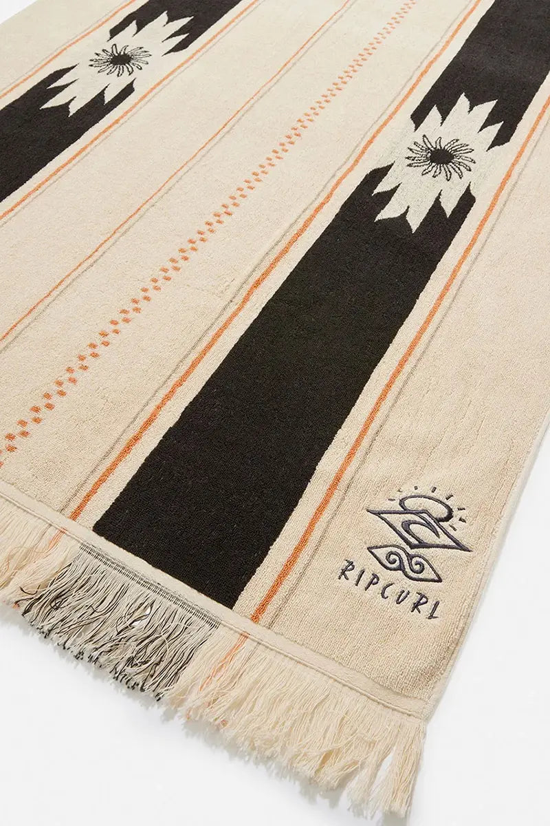 logo and tassel detail view on the Rip Curl Searchers Towel in Washed Black