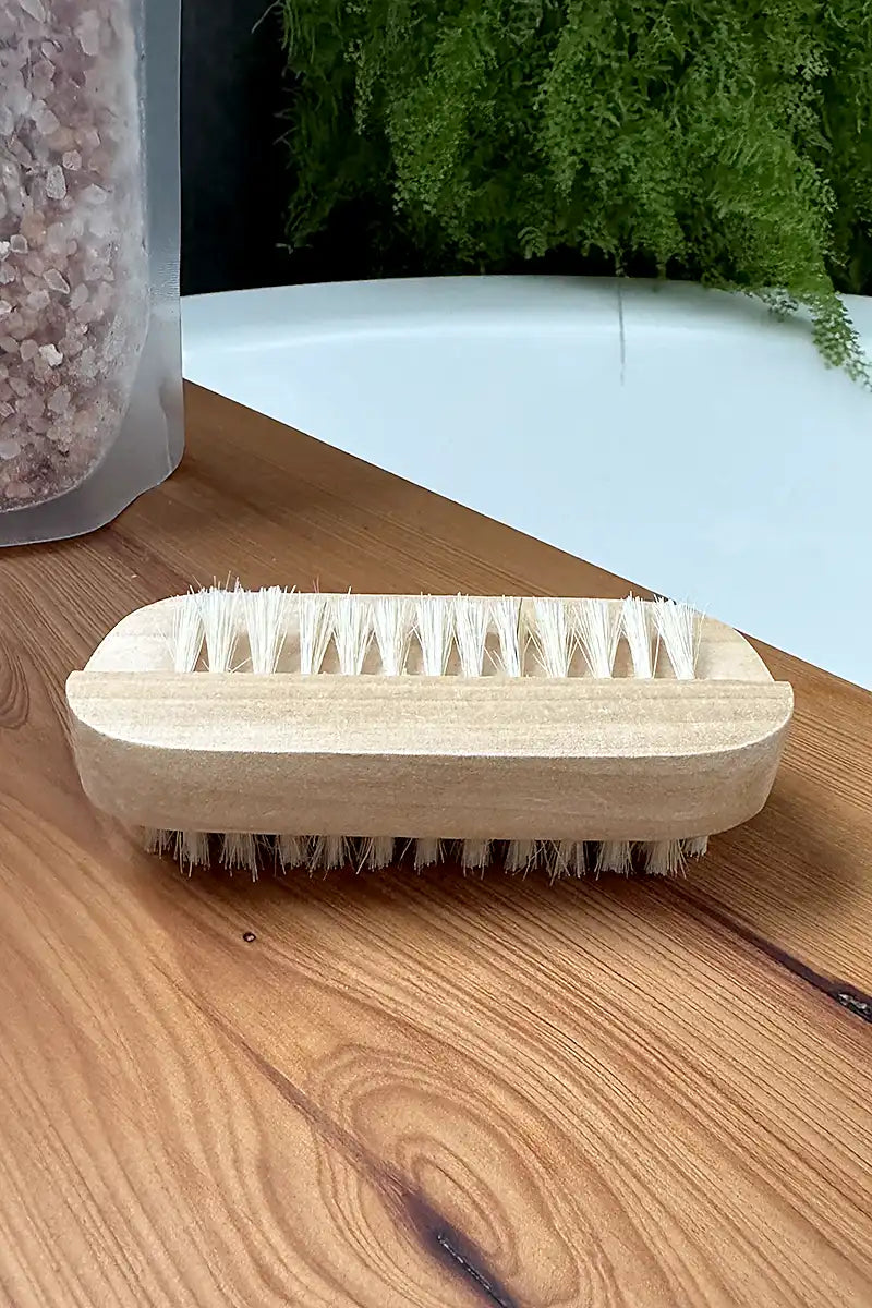Natural Wooden Nail Brush on bath board showing top side plus bristles