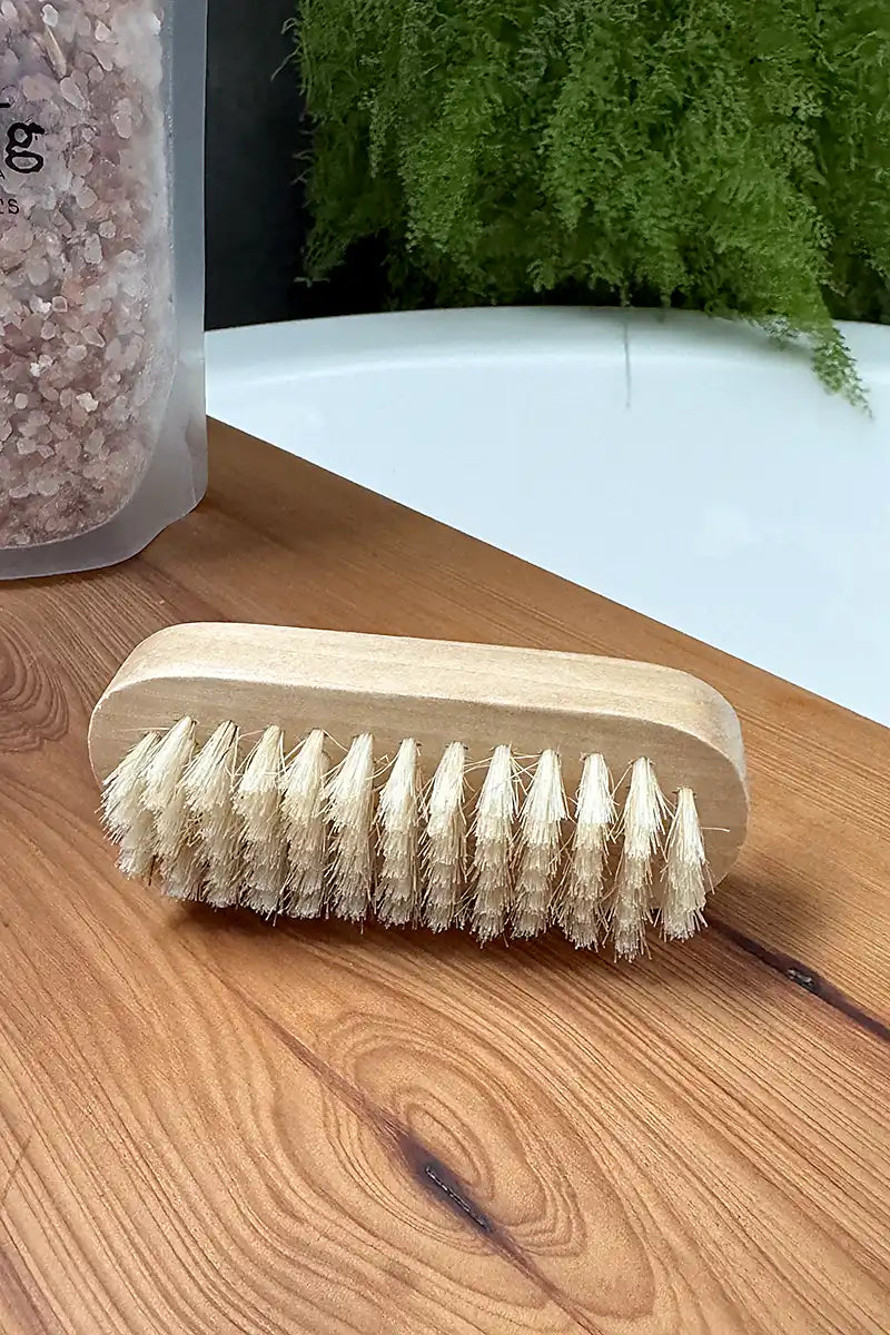 Natural Wooden Nail Brush on bath board showing bristles