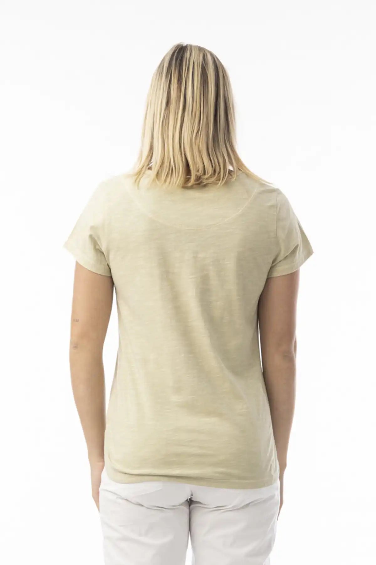 Person wearing a beige t-shirt on a white background standing with back to camera