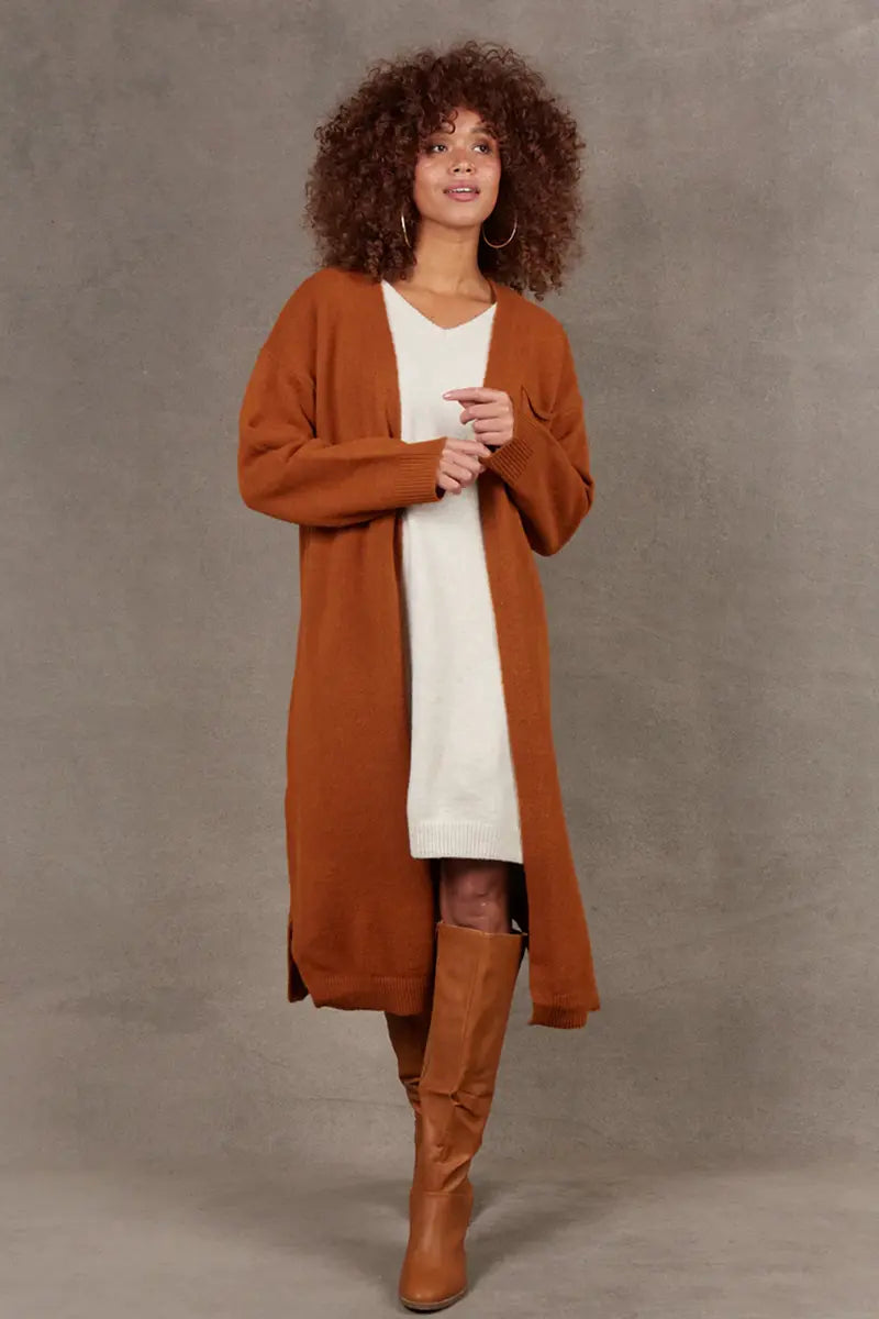 front view with model walking wearing Paarl Longline Cardigan in Ochre by Eb & Ive