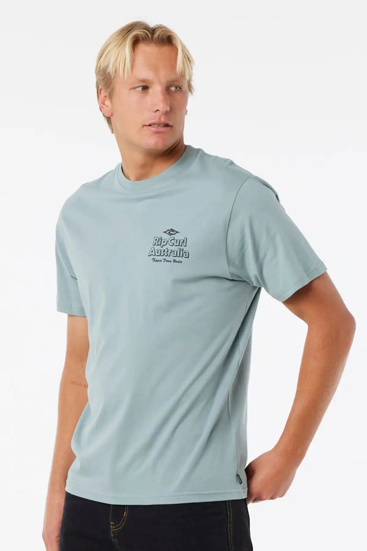 Man wearing a light blue t-shirt with a logo on a white background