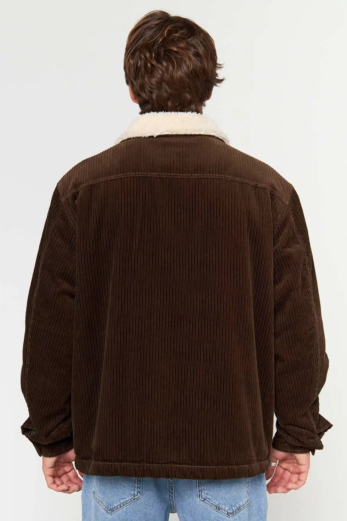 Man wearing Rip Curl Men's Bells Sherpa Jacket in Coffee corduroy jacket with a white collar on a white background back view