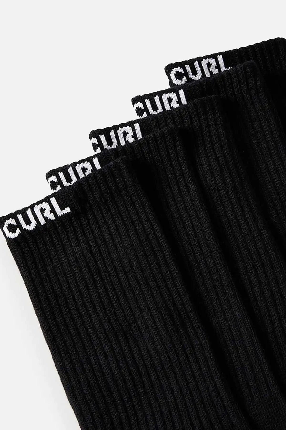 Black ribbed socks with 'CURL' branding on a white background