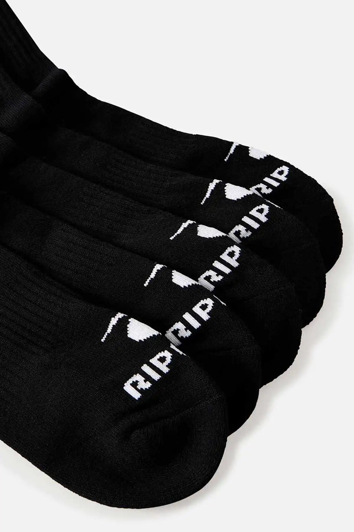 Black socks with 'RIP CURL' branding on a white background toe detail