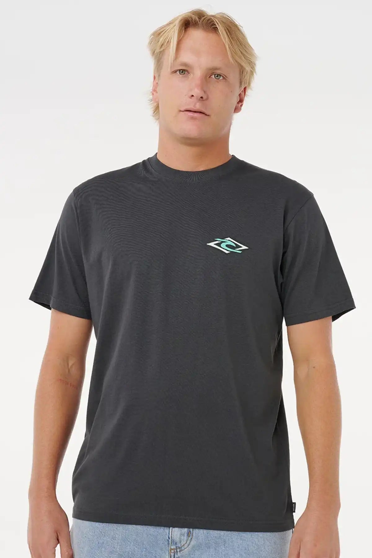 Man wearing a washed black t-shirt with a rip curl logo on a white background