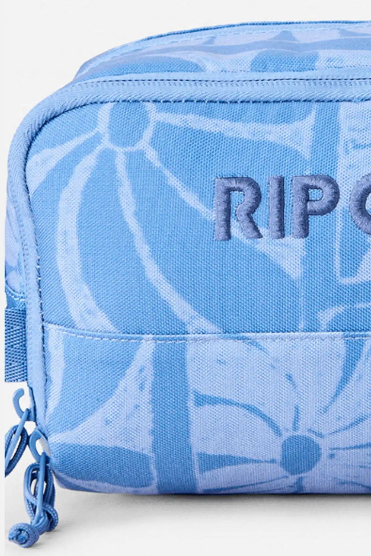 Blue pouch with floral pattern and 'Rip Curl' branding on a white background