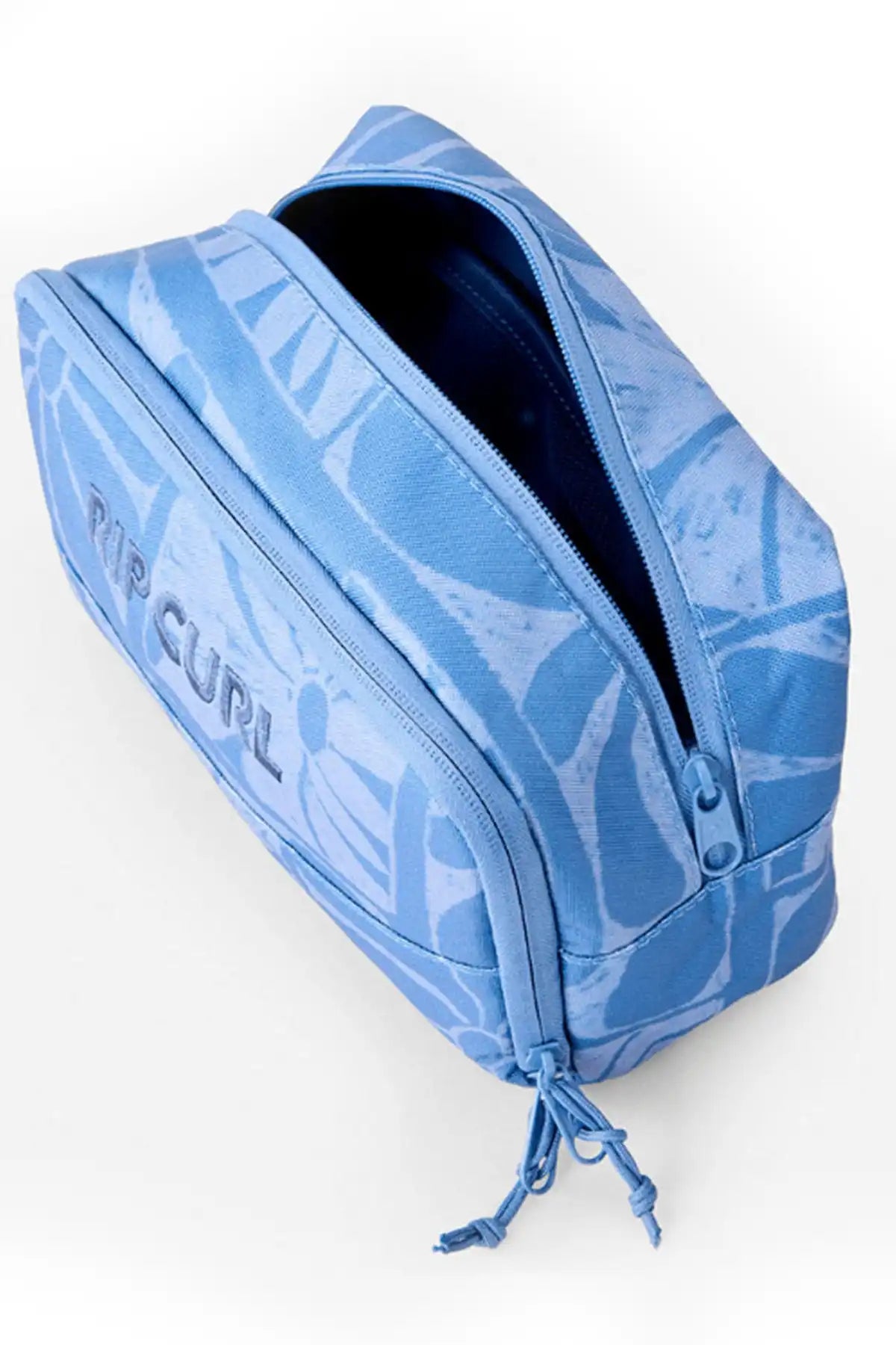Blue toiletry bag with 'The Curl' branding on a white background
