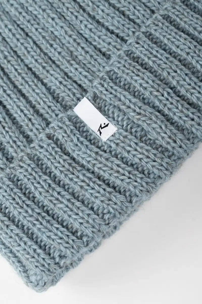 Rusty Women's Homeslice Beanie in Glacial Blue logo patch detail