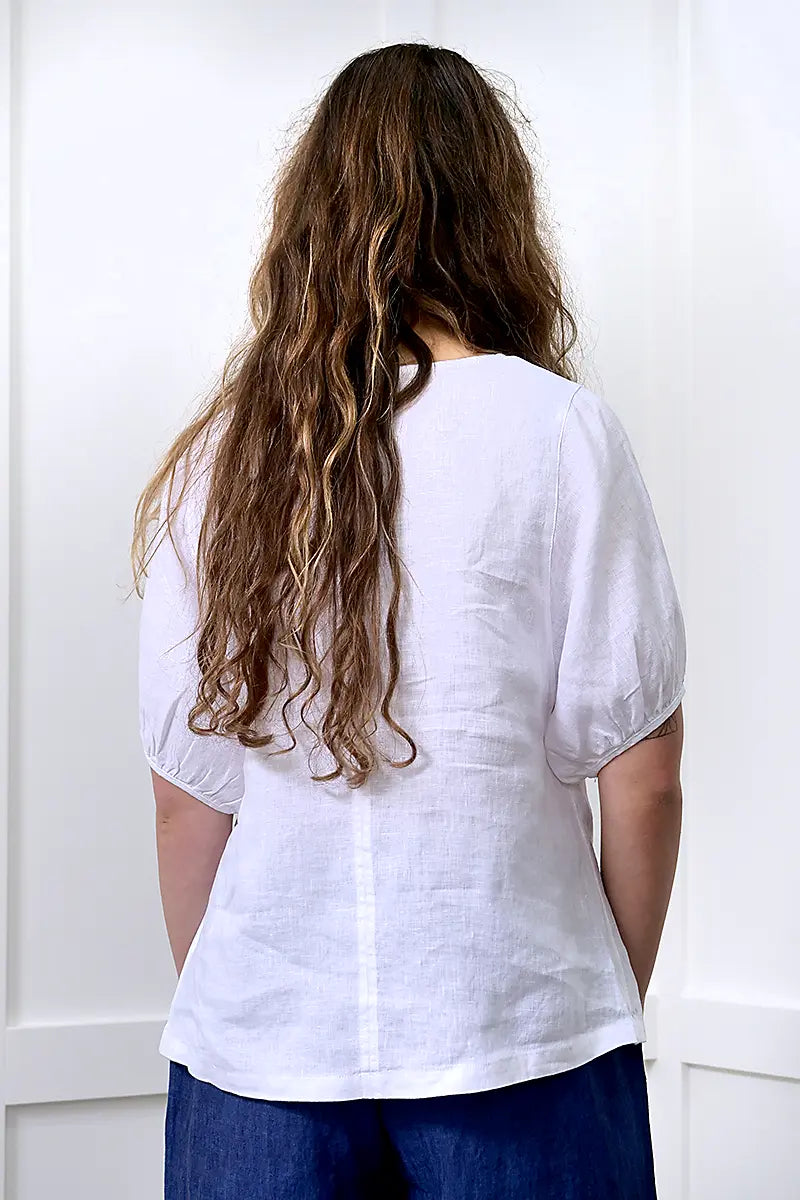 back view of the See Saw Linen V-Neck Swing Top in White