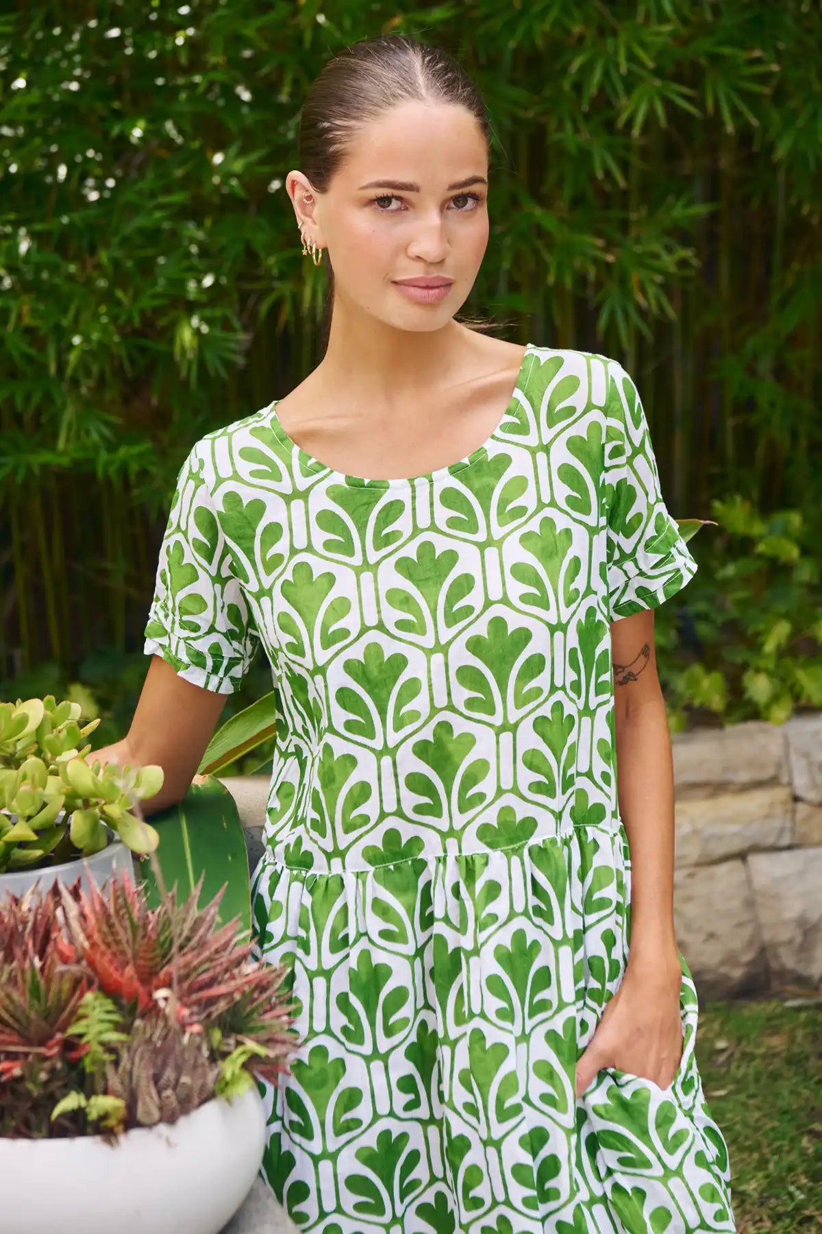 detailed view of the summer garden dress worn by a lady standing in the garden