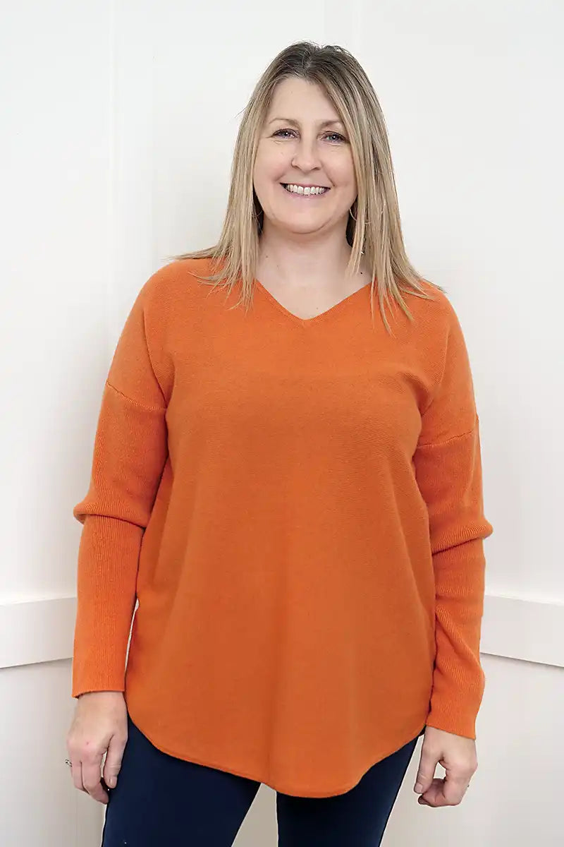 The Rust Glow Lambswool V-Neck Sweater front detailed view