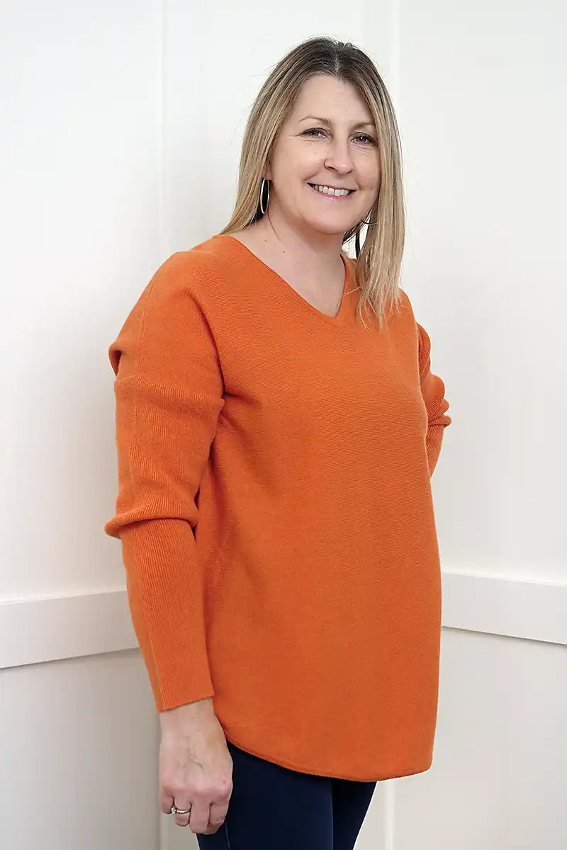 The Rust Glow Lambswool V-Neck Sweater side view