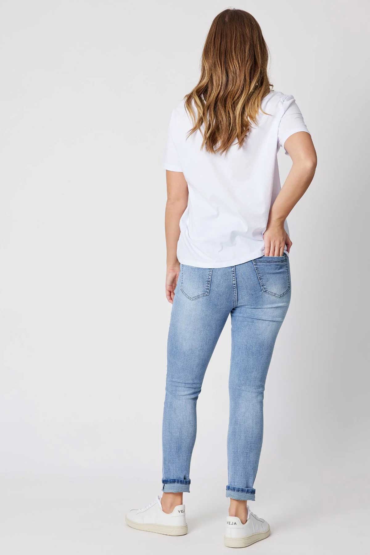 Woman wearing Threadz cotton jogger pant in denim and white tee back view