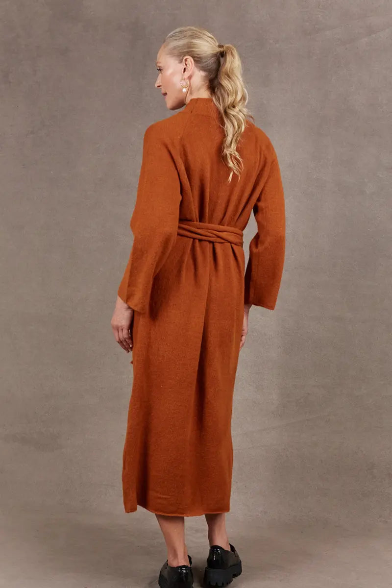 back view of the Paarl Tie Knit Dress in Ochre by Eb & Ive with the waist tie on