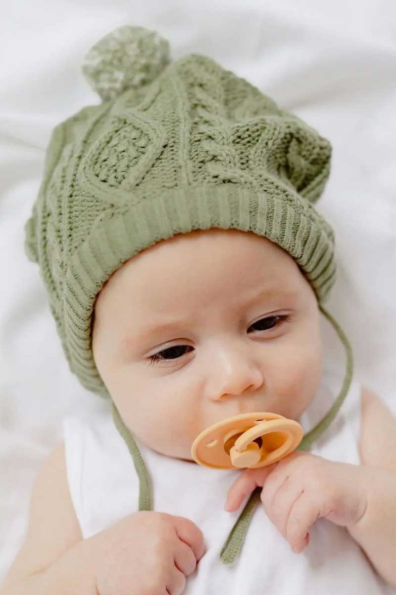 baby wearing mint coloured Luna Bonnet Hat from Di Lusso
