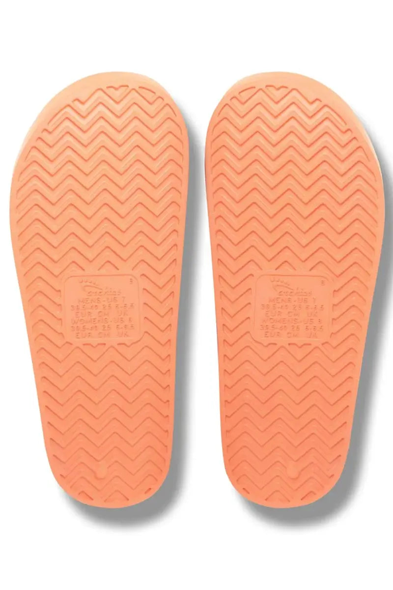 view of the soles on the Archies Arch Support Slides in Peach