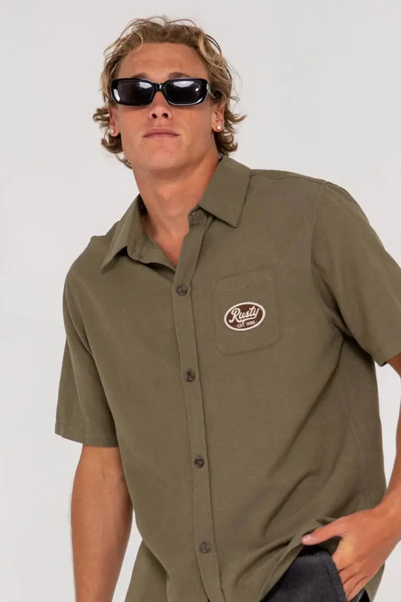 front detailed view of the Rusty Mens S/S Shirt Greaser Overtone in Savanna Green