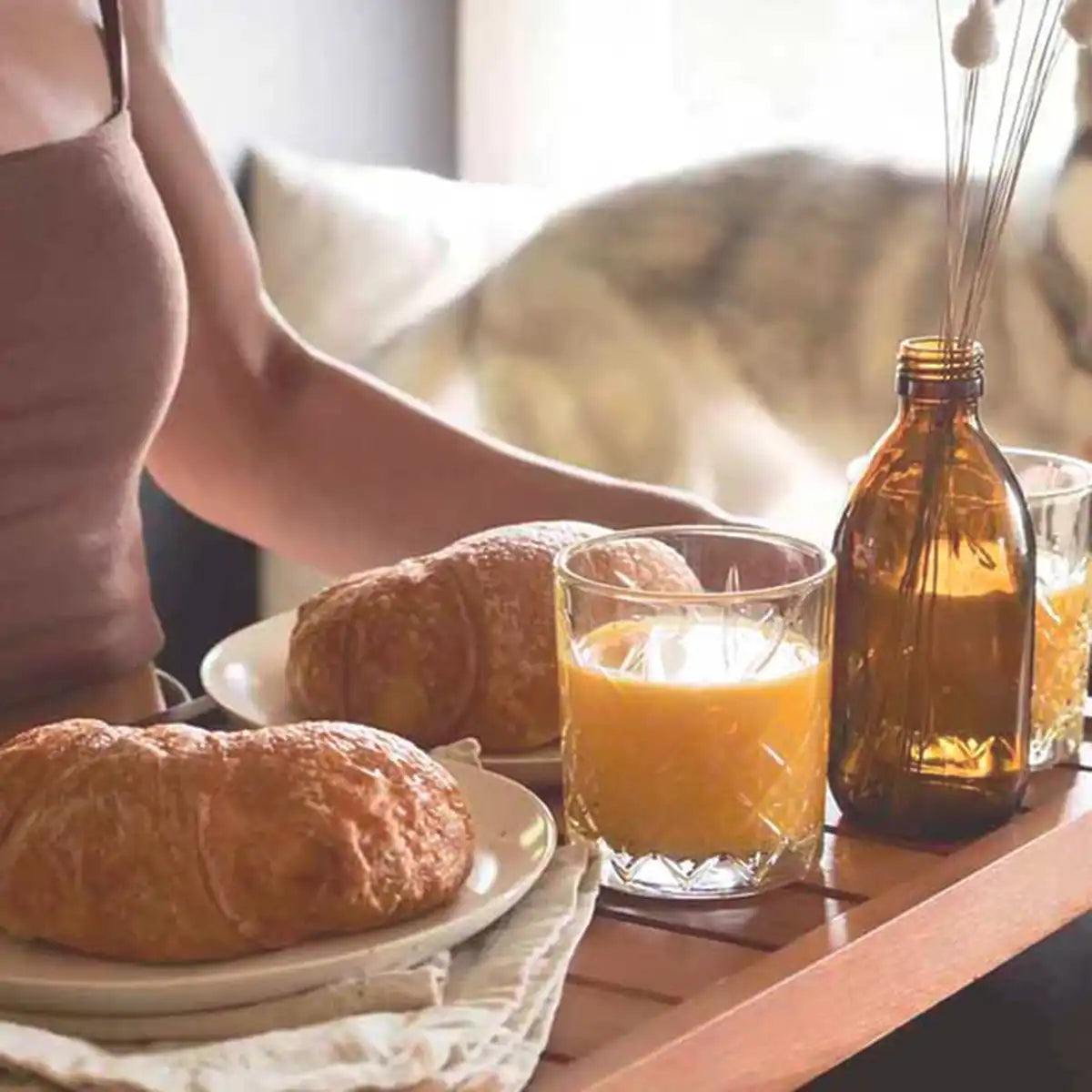 A lovely breakfast of croissants and juice, immortalizing the calm, slow weekend days and lifestyle.