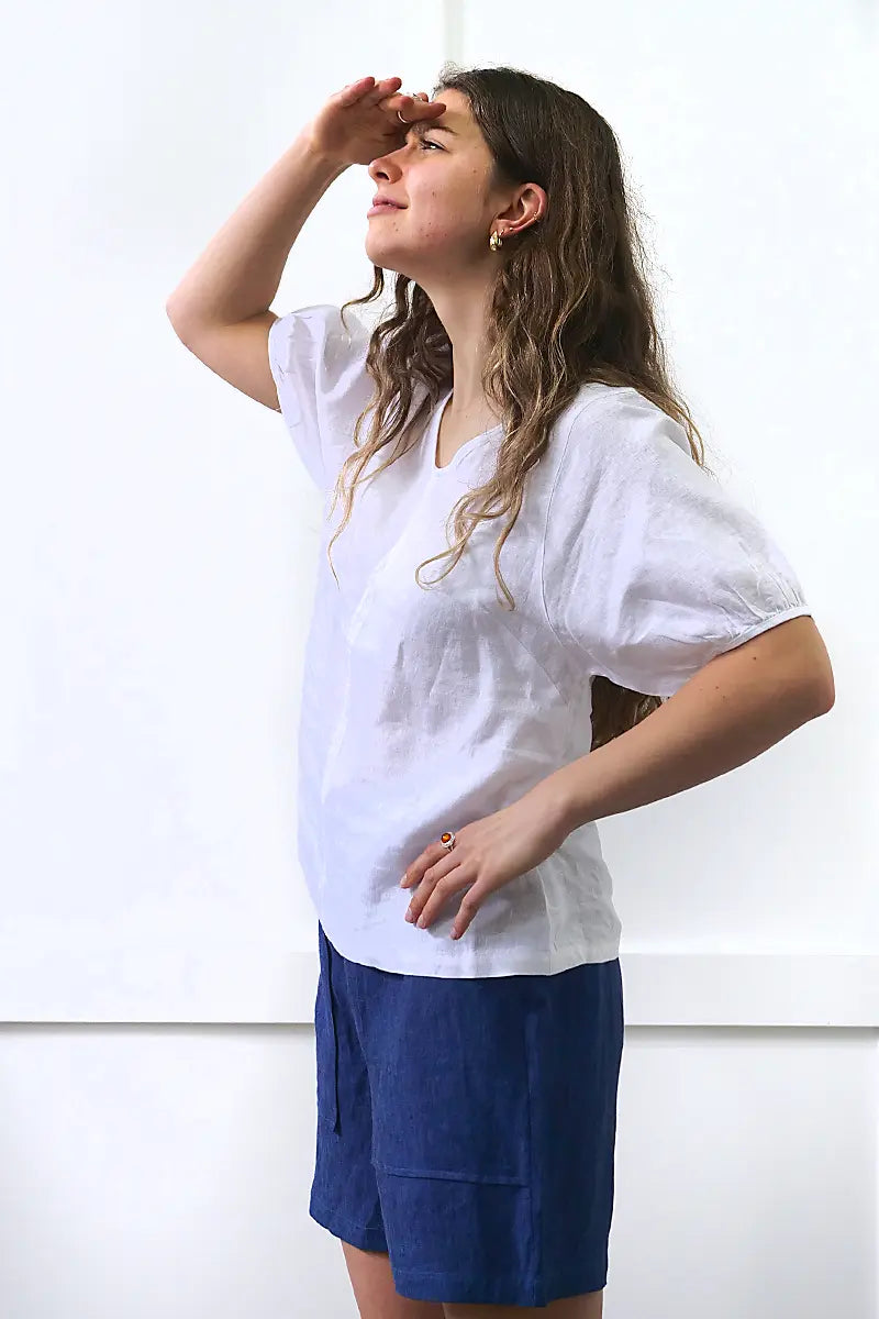 side view of the See Saw Linen V-Neck Swing Top in White