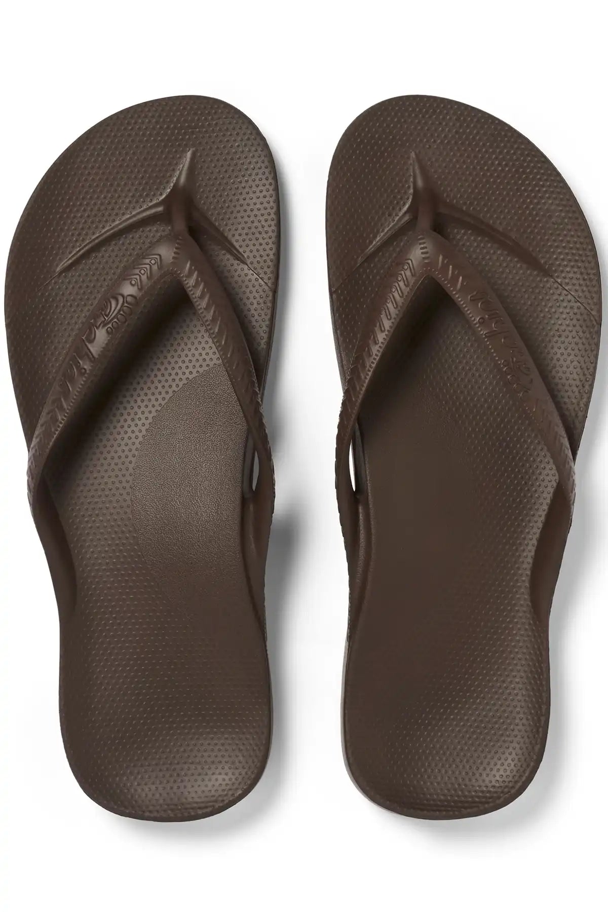 Pair of brown flip-flops on a white background