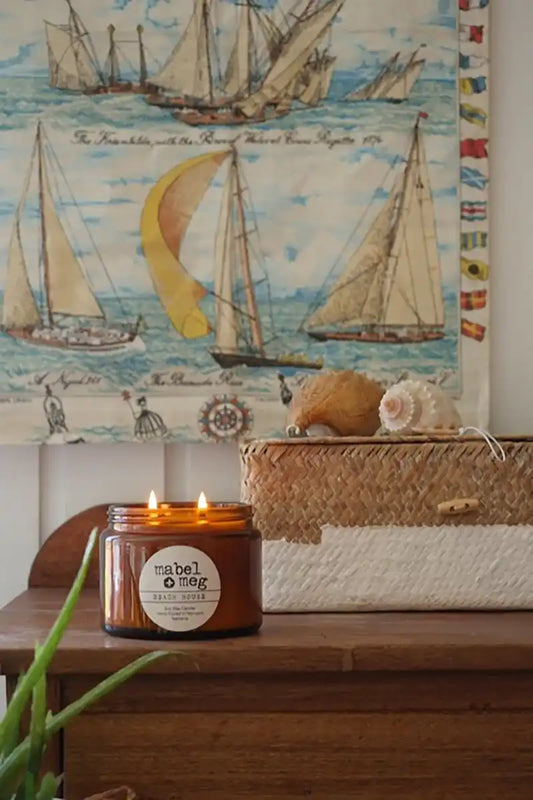 Beach house soy candle on sideboard