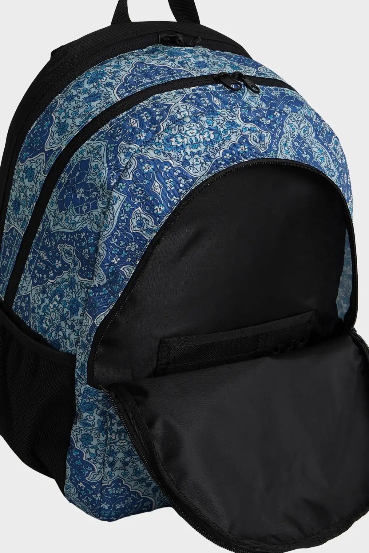 Billabong  Bohemia Mahi Backpack with blue patterned top section and black bottom section on a white background