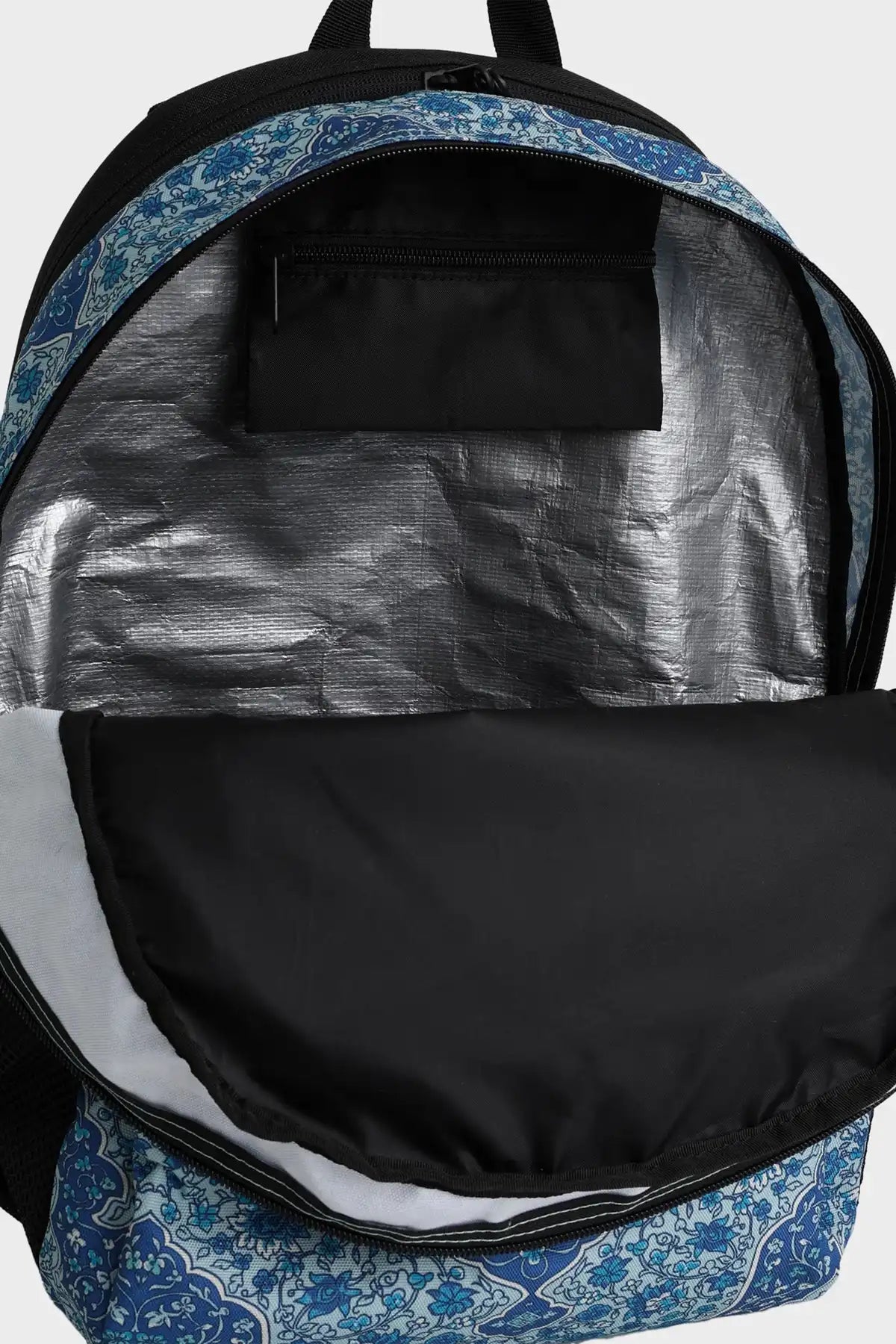 Billabong  Bohemia Mahi Backpack with blue floral pattern on straps and base, gray interior, black flap.