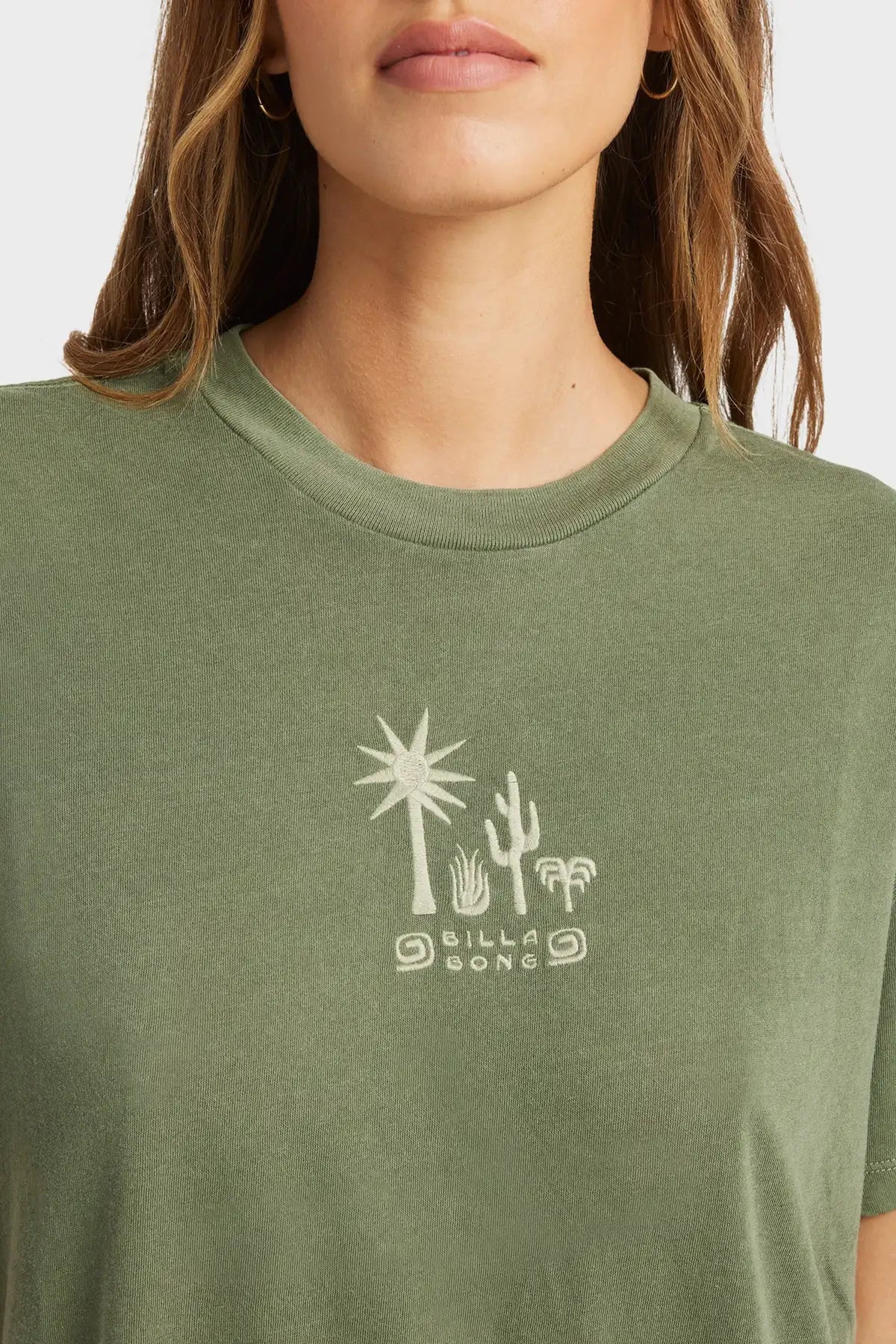 Green t-shirt with a Billabong  desert-themed graphic and 'Billabong' branding.