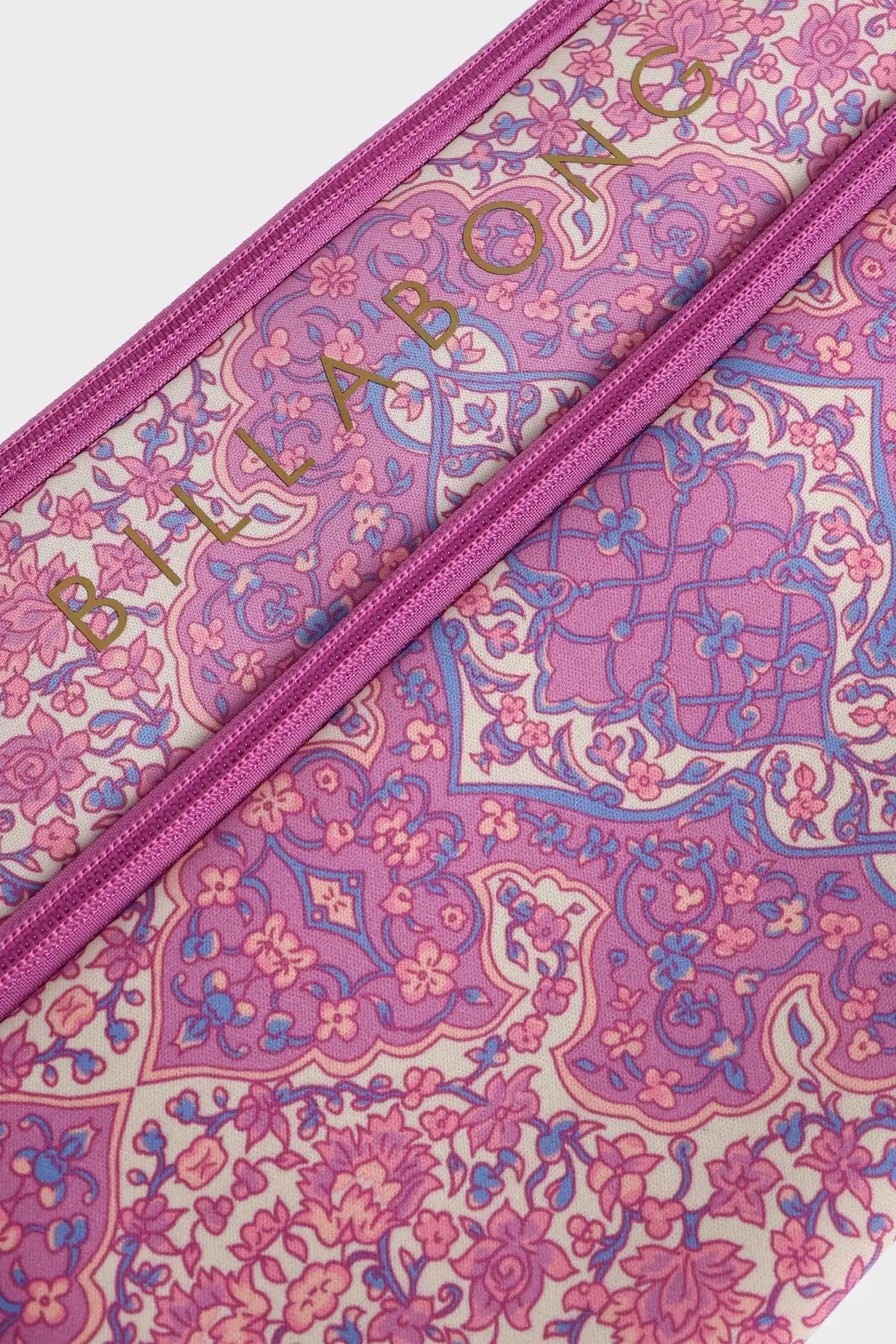 Pink Billabong and purple patterned pouch with a zipper