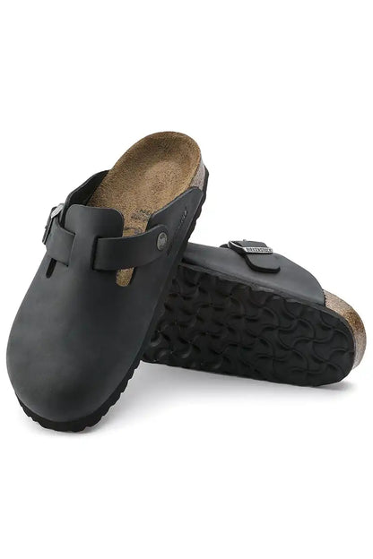 Birkenstock Boston Black Oiled Leather - Regular pair position so you can see the top of one and soul of the other shoe