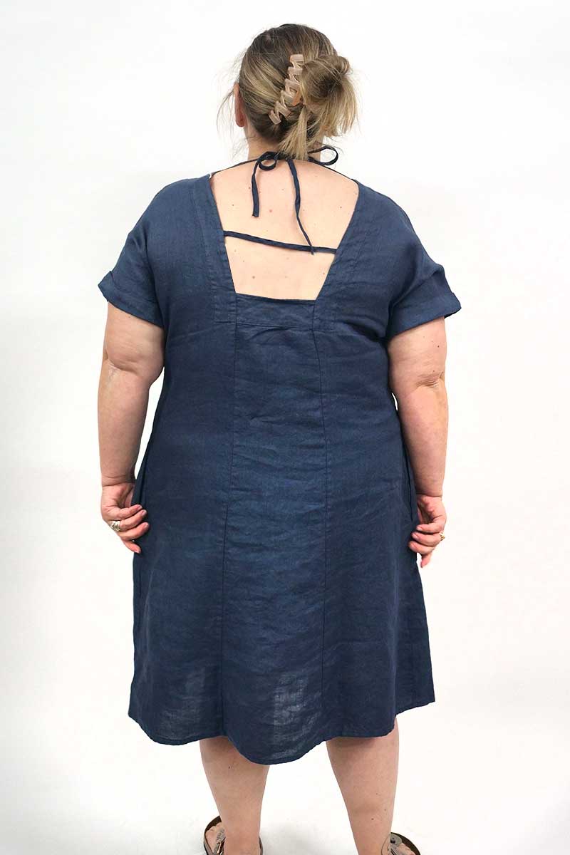 back view of the Blueberry Italia Short Linen Dress - Cut Out Back in Navy