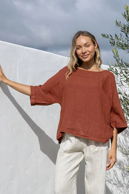 Woman wearing coco Italian linen top with boat neckline and 3/4 sleeves