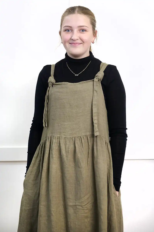 Chille Merino Whisper Top in black under a olive pinafore dress